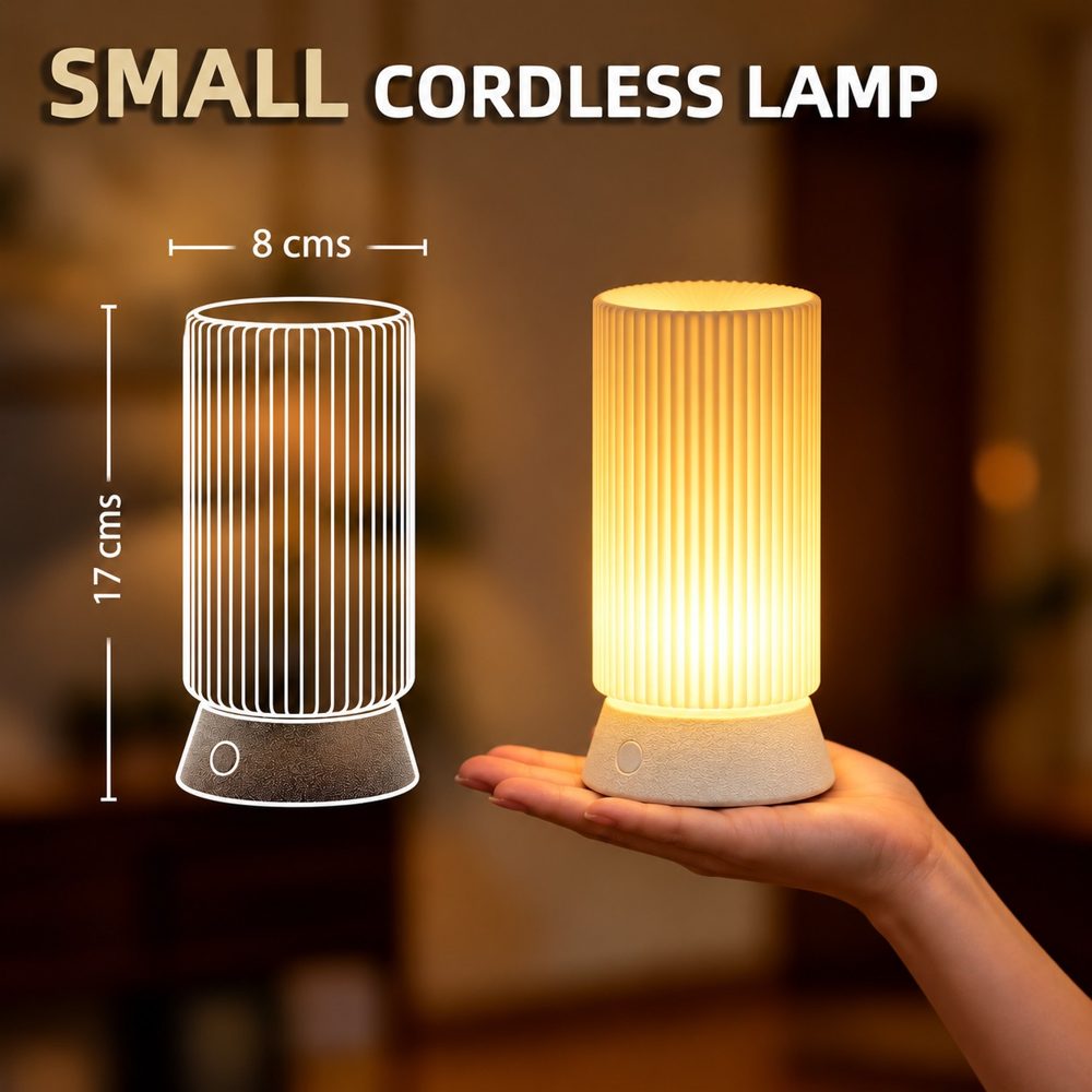 Muvelo size image: small cordless lamp, 8 by 17 cm, held in a hand